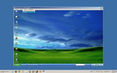 Windows 7 showing XP in Window.jpg